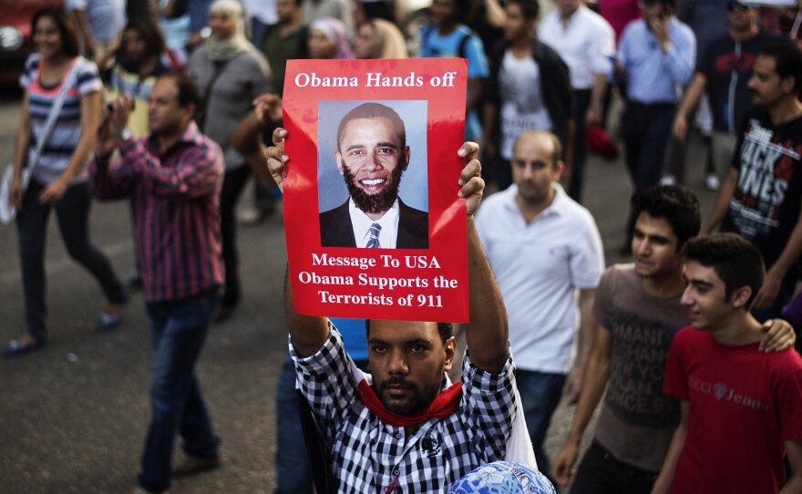 A protester denounces President Obama during a march near Cairo's Tahrir Square on July 7. Bitter rivals in Egypt tend to be united in opposition to the U.S. government, which has been a leading aid donor to the country for decades.