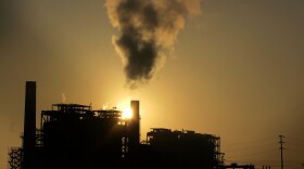 The sun sets on a power generating plant in Huntington Beach, Aug. 31, 2006.