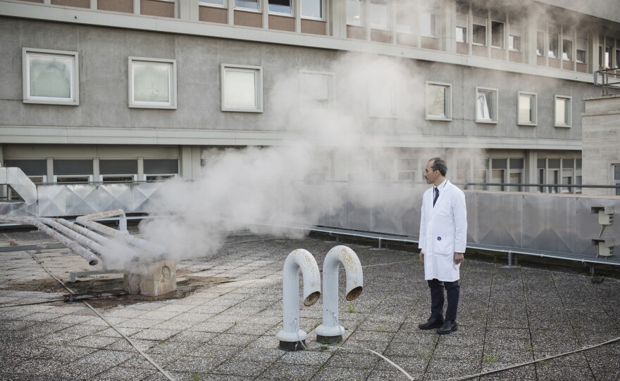 Psychiatrist Maurizio Pompili stands on the roof of Sant'Andrea hospital, where he works in Rome. The pandemic has unleashed "human misery," he says. His goal is to offer help to those who are suffering.