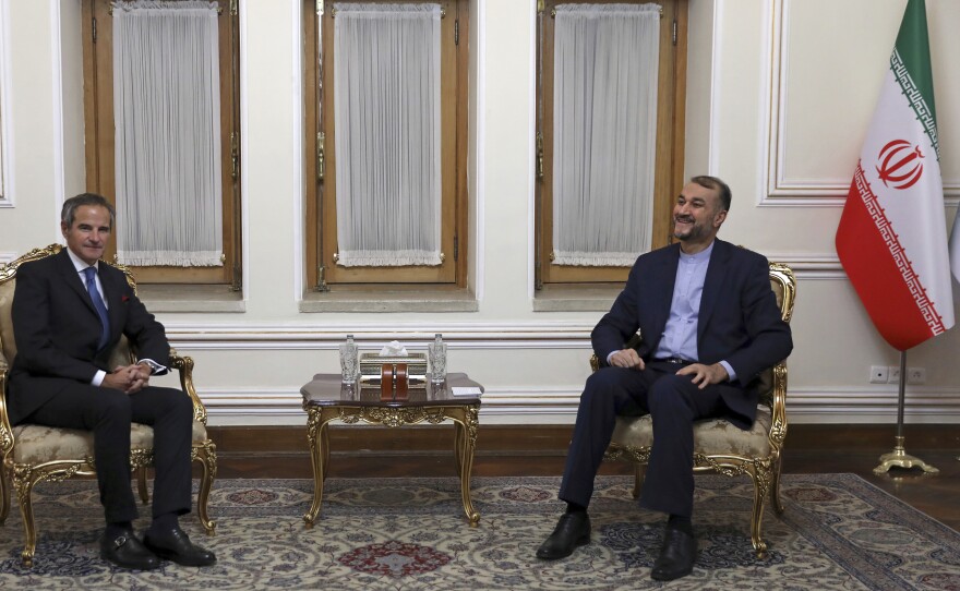 Head of the International Atomic Energy Agency Rafael Mariano Grossi, left, and Iranian Foreign Minister Hossein Amirabdollahian pictured meeting in Tehran, on Tuesday. Grossi pressed for greater access in the Islamic Republic ahead of diplomatic talks restarting over Tehran's tattered nuclear deal with world powers.