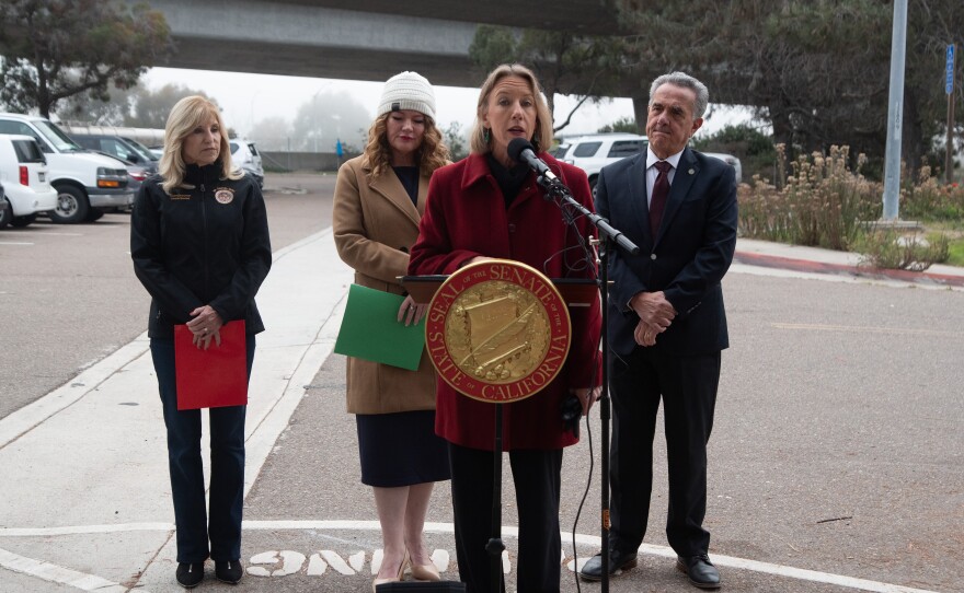 State senator Catherine Blakespear speaks alongside other elected state and local officials next to I-5 and SR-56, Dec. 16, 2025.