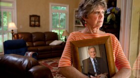 Cheryl Morgan (pictured), whose story is featured in "Life And Death In Assisted Living," holds a photo of her late father, who had dementia. He died after drinking unsecured toxic dish washing liquid at a Georgia assisted living facility.