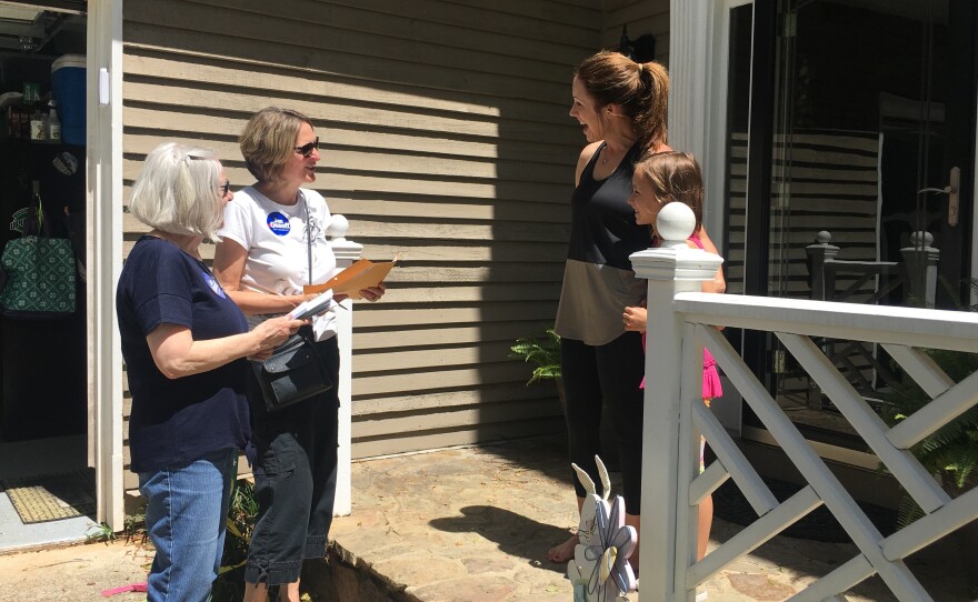 Christina Ferguson and Anna Cay Robertson canvass for Democrat Jon Ossoff ahead of Tuesday's special election in Georgia's 6th District. Megan Tucker tells them she is voting for Ossoff.