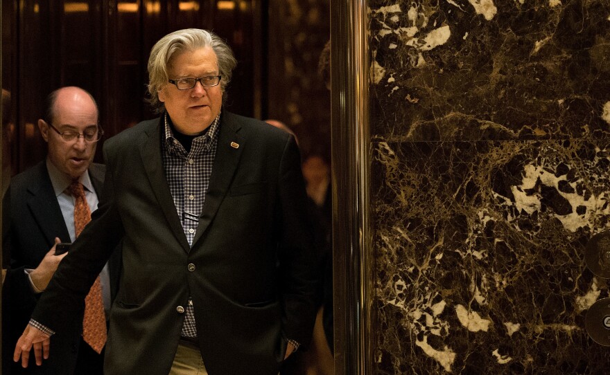 Steve Bannon exits an elevator in the lobby of Trump Tower on Friday. He has been newly named the chief strategist of the Trump White House.