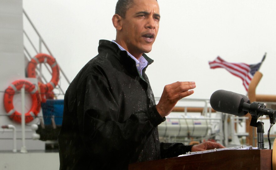 President Obama, standing in the rain, makes a statement to reporters in Venice, La., as he visits the Gulf Coast region affected by the oil spill on Sunday.