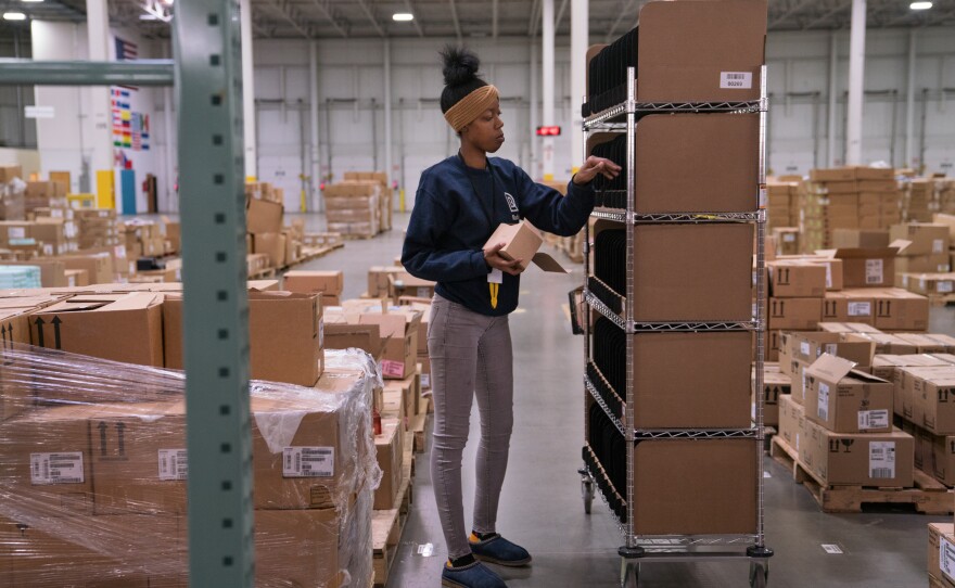 Alvine Bunch, 23, used to work at Amazon as a picker, but now does the same work at Radial. She says she does expect more robots in warehouses of the future "but not to the point whereas there's just no work to do."
