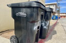 Trash bins stand in an alley in Ocean Beach, Sept. 17, 2025.