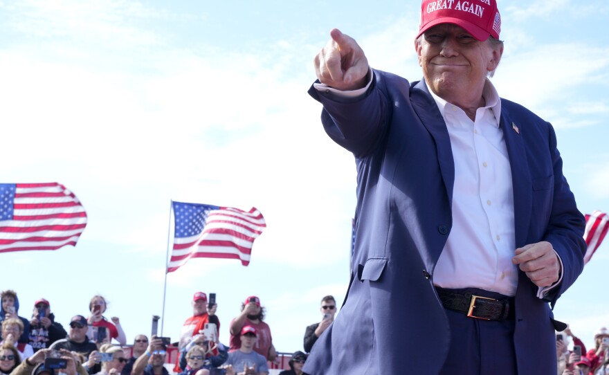 Republican presidential candidate former President Donald Trump gestures to the crowd at a campaign rally Saturday, March 16 in Vandalia, Ohio.