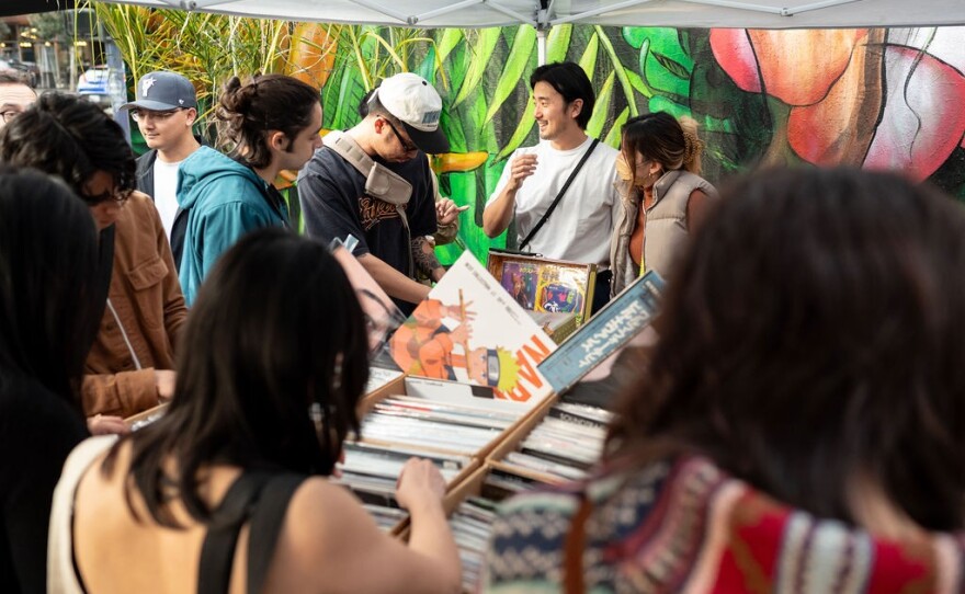 Shoppers browse through records at a 2023 Holiday Market collaboration between Part Time Lover, Folk Arts, In Sheeps Clothing and Japonesia. This year's event is at the Museum of Contemporary Art San Diego.