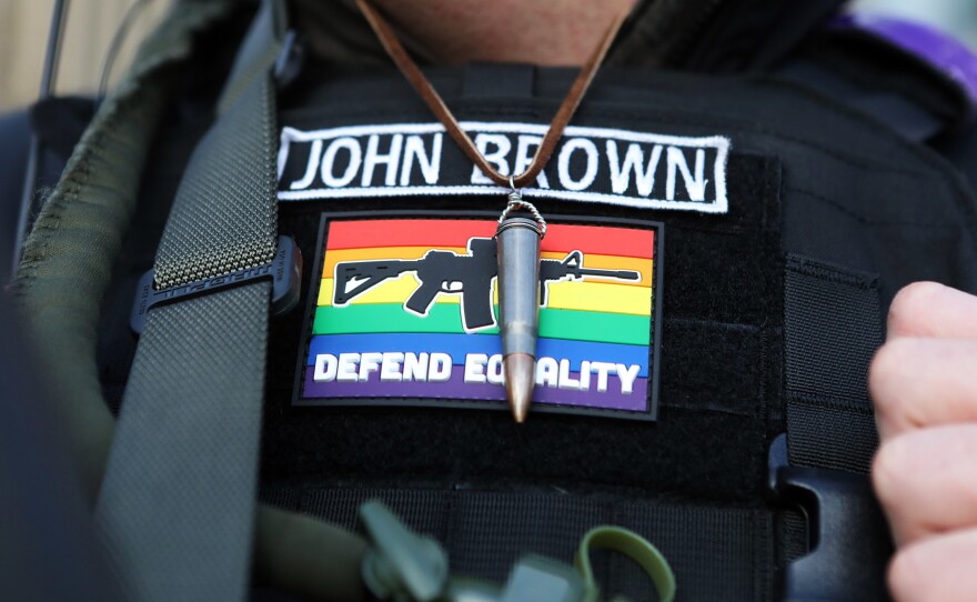 Nick Vasiliy, a member of the Puget Sound John Brown Gun Club, wears a bullet that belonged to Willem van Spronsen as the group provides security to counterprotesters at a far-right rally in Seattle in January.