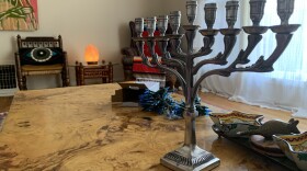 Jews around the U.S. are balancing the desire to celebrate Hanukkah and the need to feel safe.
