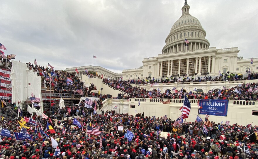 Pro-Trump extremists assaulted the U.S. Capitol on Jan. 6. The acting U.S. Capitol Police chief apologized to Congress Tuesday for the department's failure to secure the building.