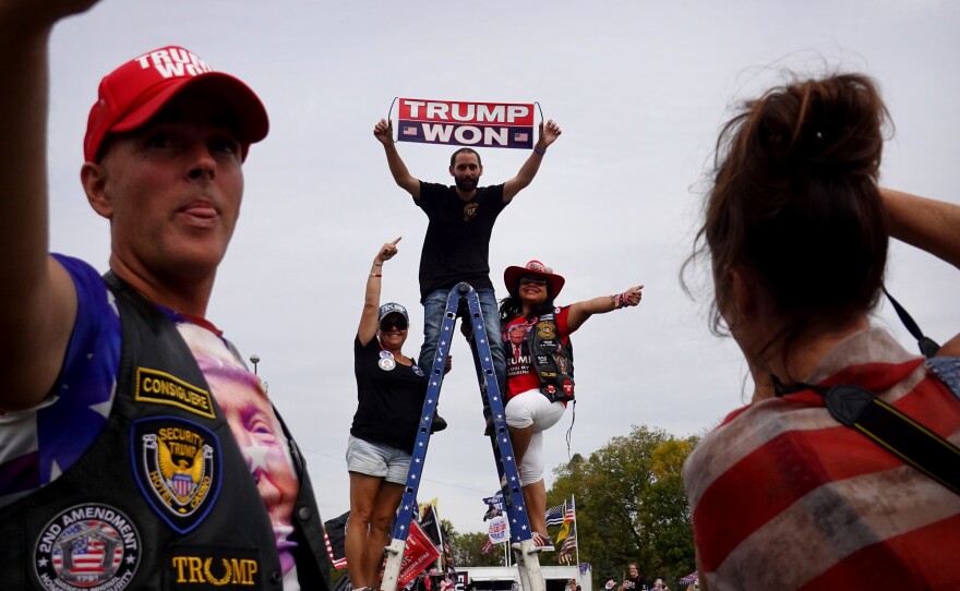 Guests arrive for a rally with former President Donald Trump at the Iowa State Fairgrounds on Oct. 9, 2021 in Des Moines.