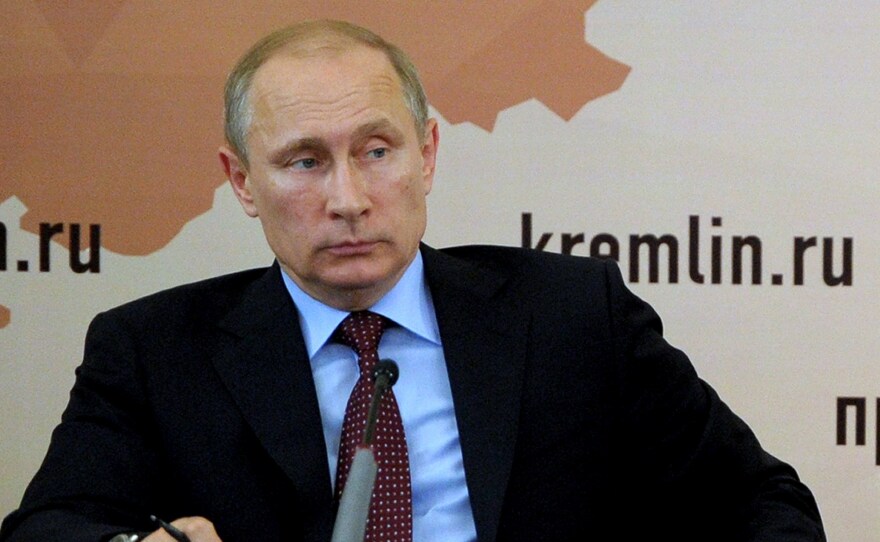 Russia's President Vladimir Putin annexed Crimea from Ukraine and placed Russian troops near that country's eastern border. While the region remains tense, the Russian president, shown here on Monday, says he will respect the results of Ukraine's presidential election.