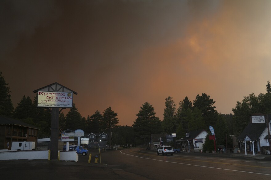 FILE - Smoke from the Line Fire fills the air Saturday, Sept. 7, 2024, in Running Springs, Calif.