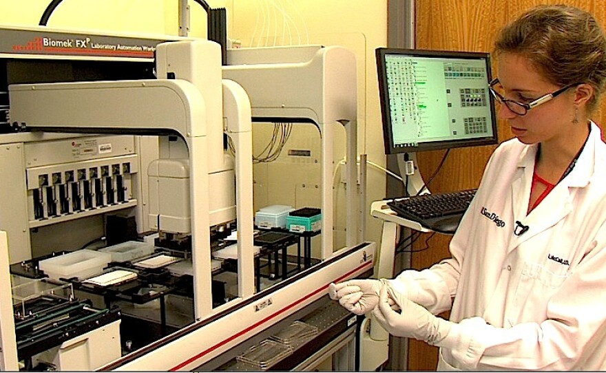 Post-doctor fellow Laura-Isabel McCall operates a drug discovery robot inside the UCSD lab, on August 20, 2015.