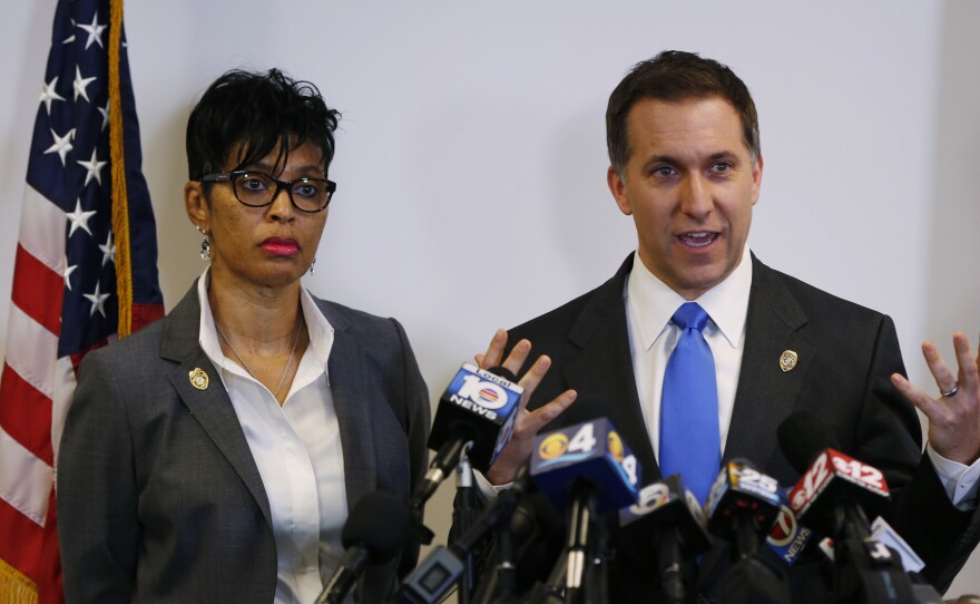 Palm Beach County, Fla., State Attorney Dave Aronberg, accompanied by Assistant State Attorney Adrienne Ellis, speaks during a news conference in West Palm Beach, Fla.