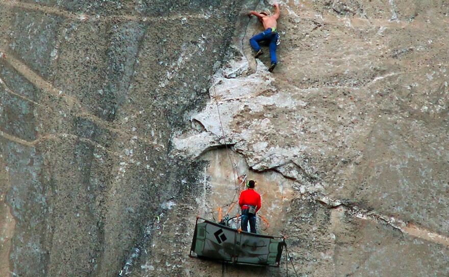 Tommy Caldwell (top) climbs what is known as Pitch 17 and Kevin Jorgeson handles the line as they attempt to free-climb the Dawn Wall of Yosemite's El Capitan. If all goes as planned, they are expected to reach the summit later today.