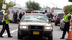 Aberdeen police officers blocks the entrance of industrial complex where several people had been shot, in Harford County, Md, Thursday, Sept. 20, 2018. 