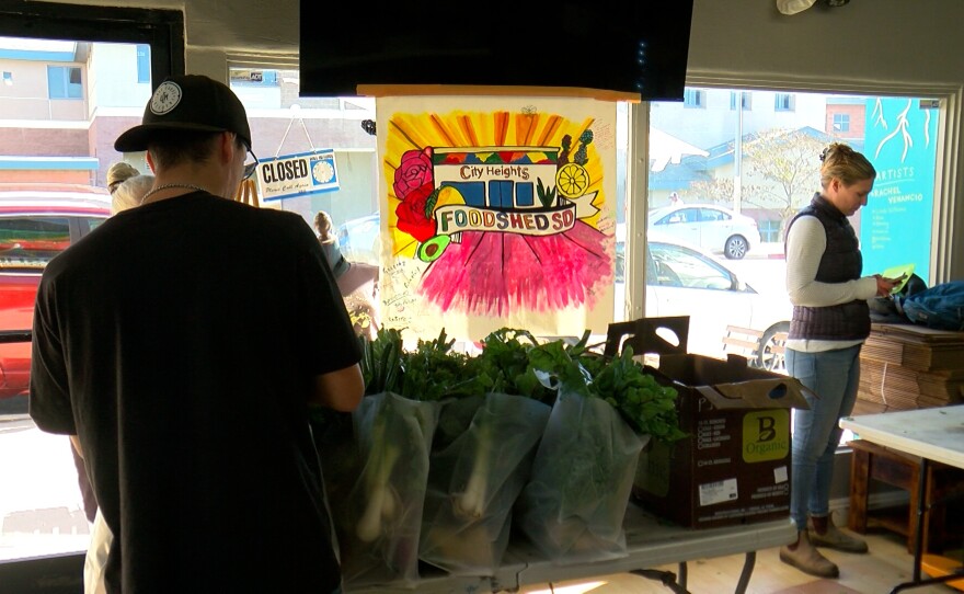 Kristin Kvernland and a Foodshed worker are shown at the Cooperative on Jan. 3, 2024.