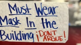 "Must wear a mask in the building" sign posted inside a restaurant in La Mesa, Oct. 25, 2020.