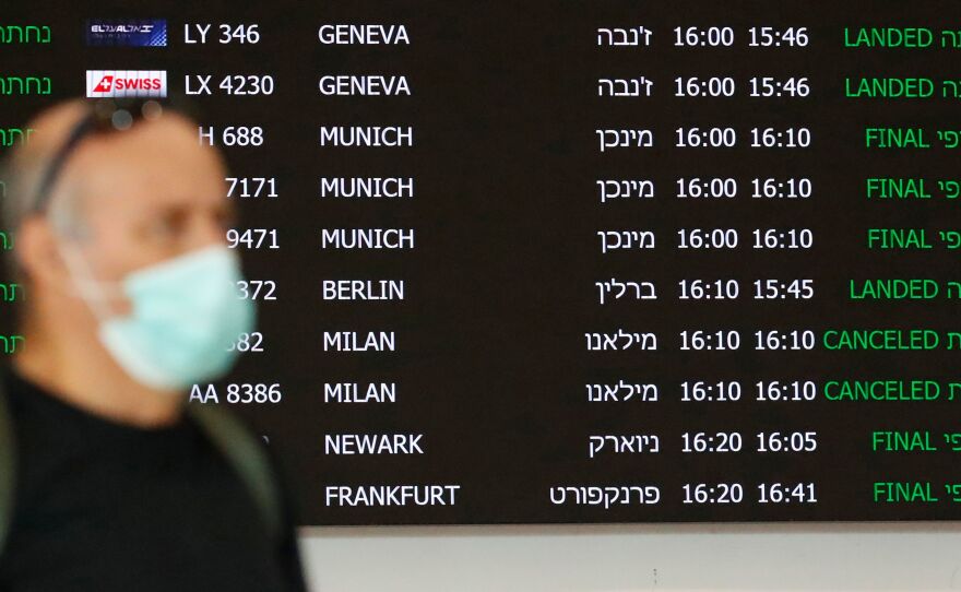 A flight information board displays canceled incoming flights from Italy at Ben Gurion International Airport, near Tel Aviv, Israel, last month. Airlines are slashing hundreds of flights amid fear of the spreading coronavirus.