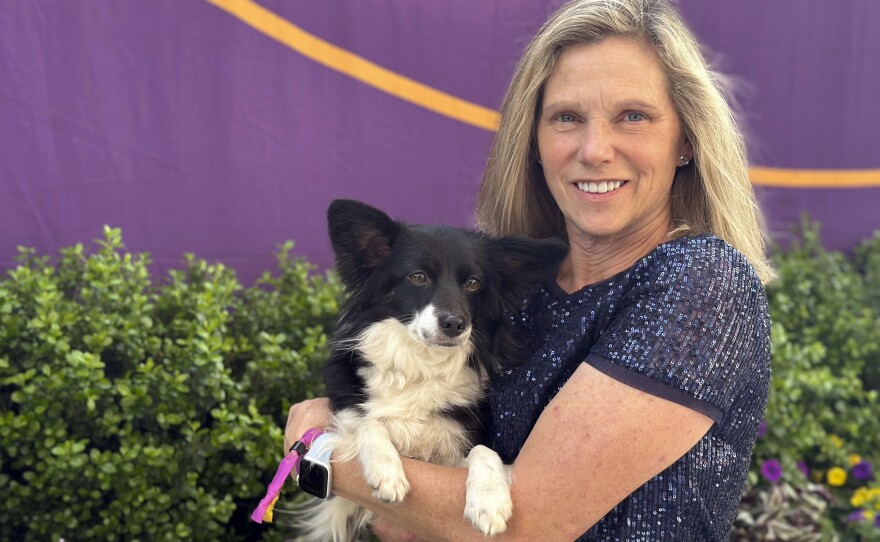 Cynthia Hornor poses with Nimble, the first mixed-breed dog ever to win the Westminster Kennel Club dog show's agility competition, in New York on Monday.