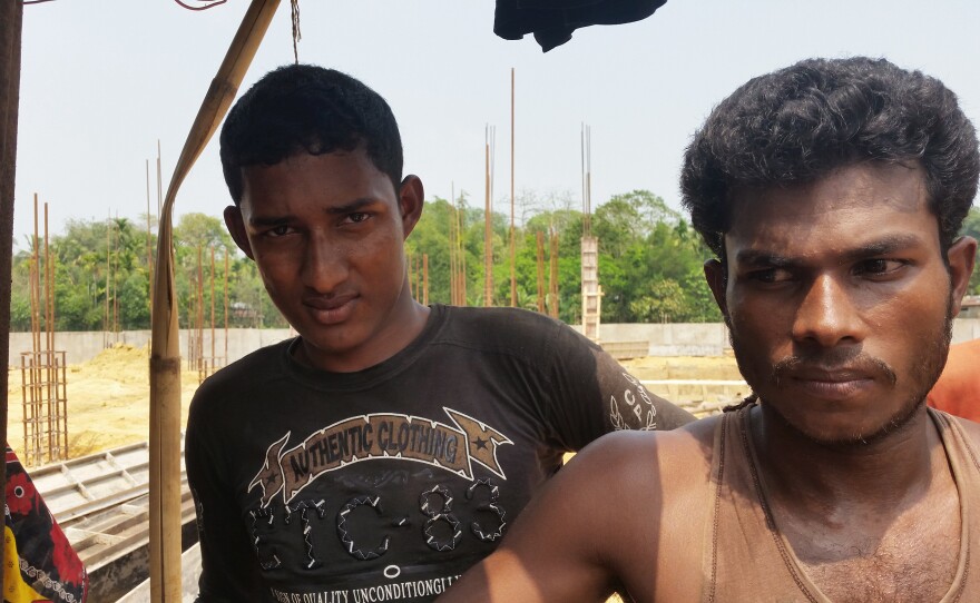 Habibur Rahaman (left) and Alauddin are Bangladeshi construction workers who worry that the influx of Rohingya refugees will make it harder to find a job. They say Rohingya are willing to work for half the wages that Bangladeshis get.