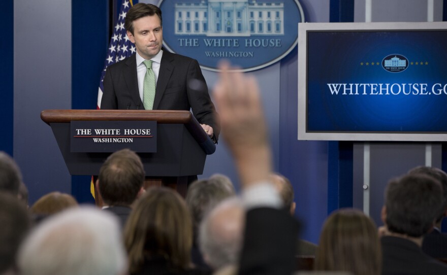 White House press secretary Josh Earnest takes questions from the press during a daily briefing in December.