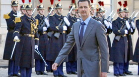 FILE - In this Dec. 9, 2010 file photo, Syria President Bashar al-Assad arrives at the Elysee Palace in Paris for his meeting with French President Nicolas Sarkozy.