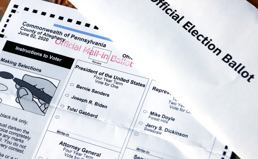 This May 26 photo shows an official Democratic primary mail-in ballot and secrecy envelope for the Pennsylvania primary in Pittsburgh.