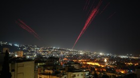 Tracer rounds illuminate the night sky as people fire live ammunition and fireworks into the air as a ceasefire was beginning between Israel and Hezbollah, in Beirut, Lebanon, in the early hours of Friday.