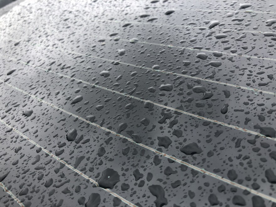 Rain drops are seen on a car window in the Allied Gardens neighborhood of San Diego, Calif. Dec. 14, 2021.