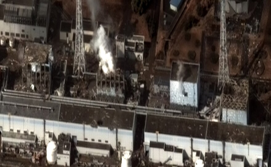 A white cloud rises from reactors at the stricken Fukushima Dai-ichi nuclear power plant on Wednesday. Though the gas contains radiation, experts say any plume that travels out over the ocean won't be of much risk to the West Coast of the U.S.