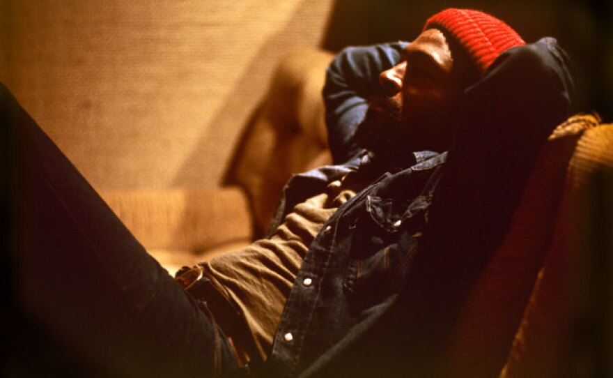 Marvin Gaye in studio couch listening to music, 1973.