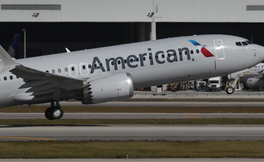 American Airlines Flight 718, a Boeing 737 Max, takes off from Miami International Airport on its way to New York on Thursday — the plane's first commercial flight in the U.S. since it was allowed to return to service. The 737 Max was grounded worldwide after two crashes due to a faulty flight system.