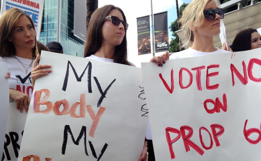 Performers from the adult film industry protest Prop 60 outside the AIDS Healthcare Foundation in Los Angeles.