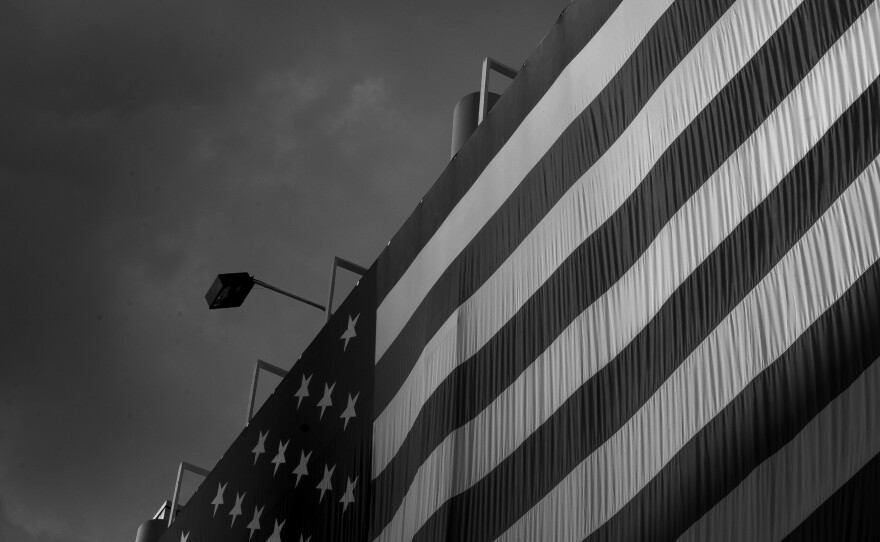 Light falls on the American flag at the Quicken Loans Arena in Cleveland.
