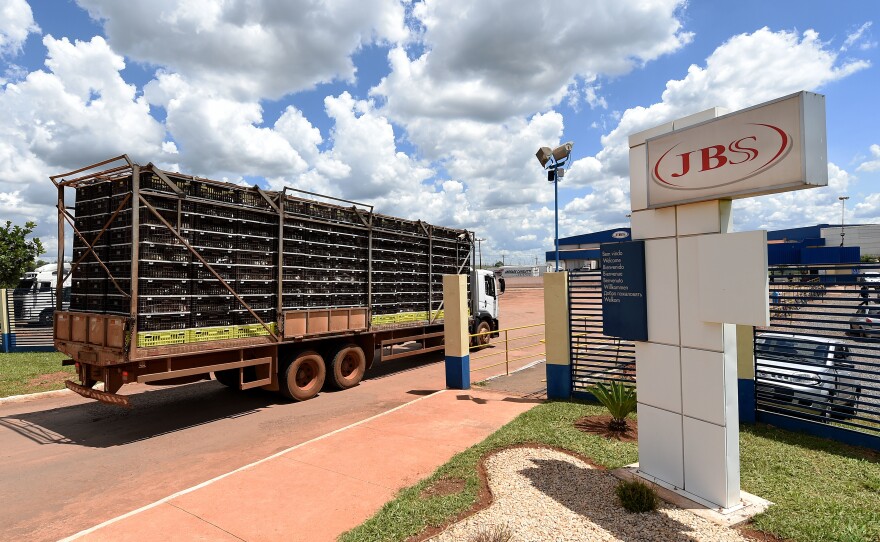 A truck loaded with chickens arrives at a JBS meat processing plant in Samambaia, Brazil, in March.