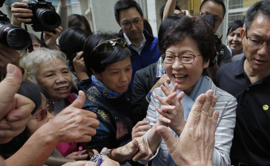 Carrie Lam, a candidate for Hong Kong's chief executive, greets supporters on Thursday. She is considered Beijing's preferred candidate and is widely expected to win Sunday's vote.