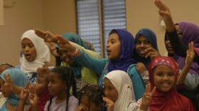 Members of Troop 4307 do the Girl Scout salute on Aug. 31, 2015.