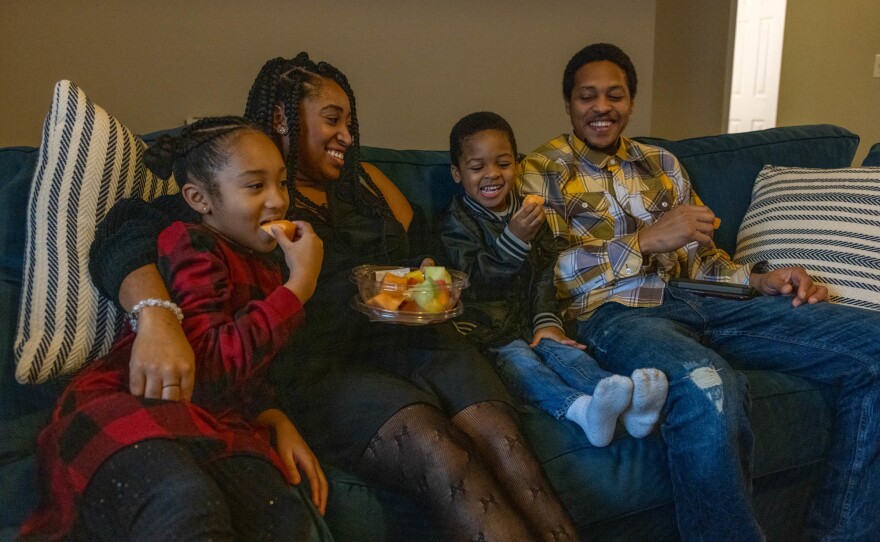 Nicole Howson spends time in her new living room with her family.