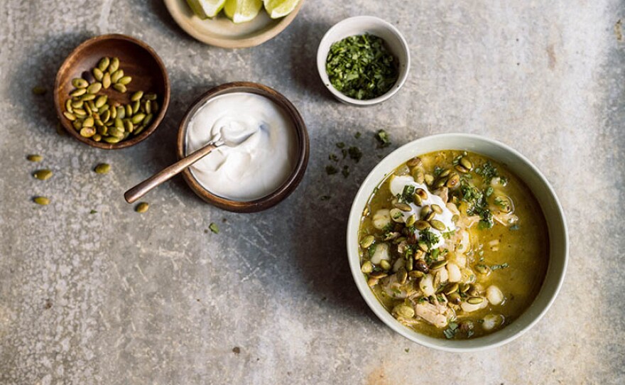 Milk Street cook Bianca Borges shows host Chris Kimball how to make Mexican chicken soup with tomatillos and hominy, a staple with a twist.