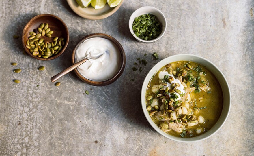 Milk Street cook Bianca Borges shows host Chris Kimball how to make Mexican chicken soup with tomatillos and hominy, a staple with a twist. 