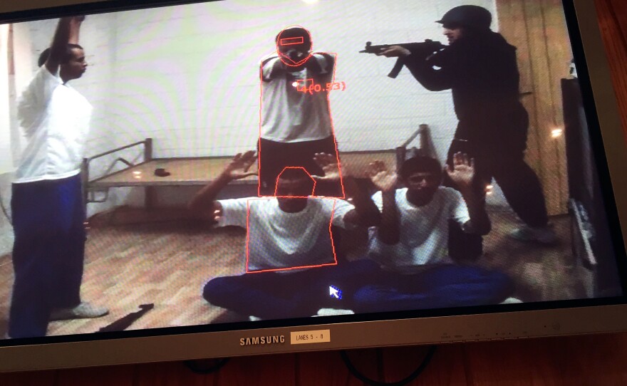 Trainees can watch playbacks of their drills. Here, a "shooter" can see where he hit his "targets" during an exercise.