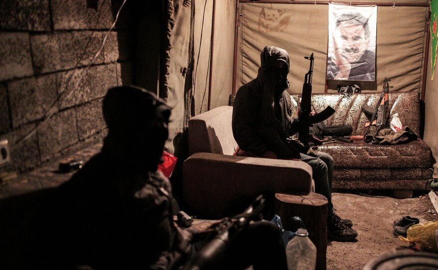 Militants of the Kurdistan Workers' Party, or PKK, in a bunker in Sirnak, Turkey, on Dec. 23. The militants and the Turkish military have been fighting regularly in southeast Turkey. A poster of jailed PKK leader Abdullah Ocalan is in the background.