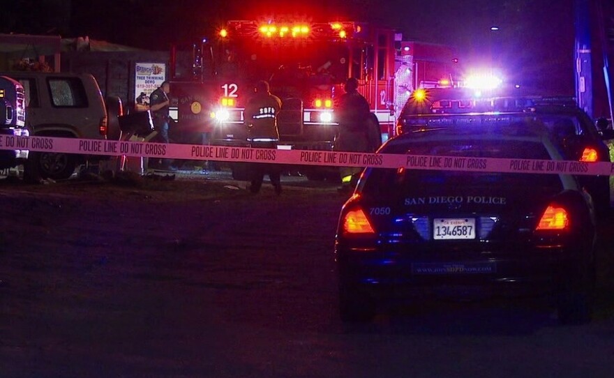 San Diego police investigate a shooting in Valencia Park that left two men dead and another wounded, May 26, 2015.