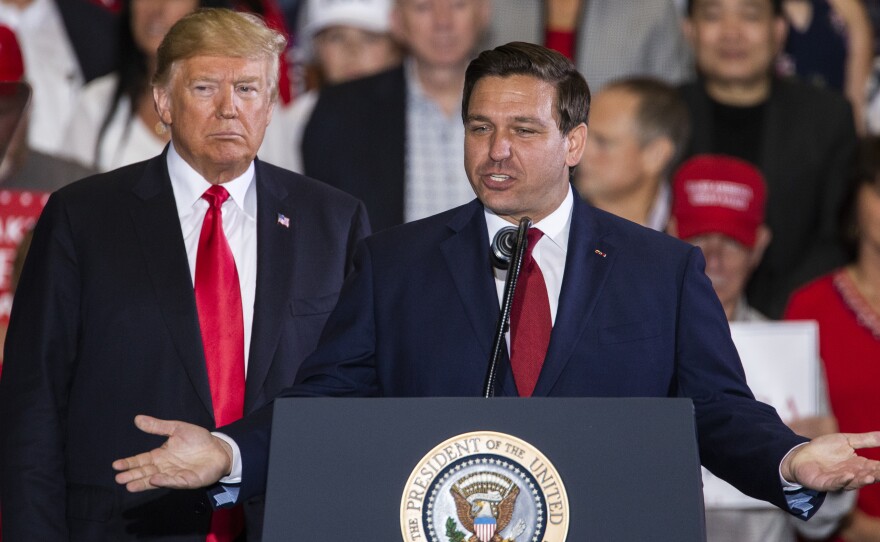 Florida Republican gubernatorial candidate Ron DeSantis speaks alongside President Trump at a campaign rally on Saturday in Pensacola, Fla.