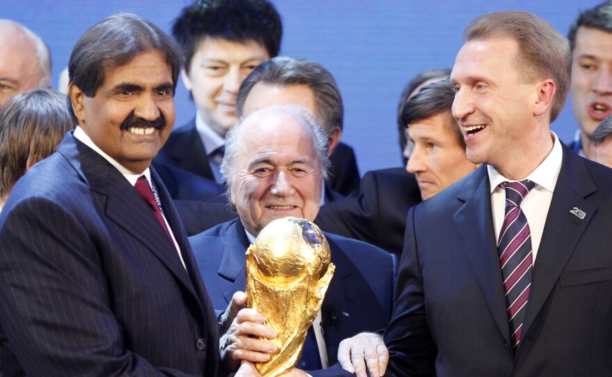 FIFA President Joseph Blatter is flanked by Russian Deputy Prime Minister Igor Shuvalov (right) and Qatari Emir Sheikh Hamad bin Khalifa Al-Thani on Dec. 2, 2010, in Zurich, Switzerland, after the announcement that Russia will host the 2018 World Cup and Qatar in 2022.