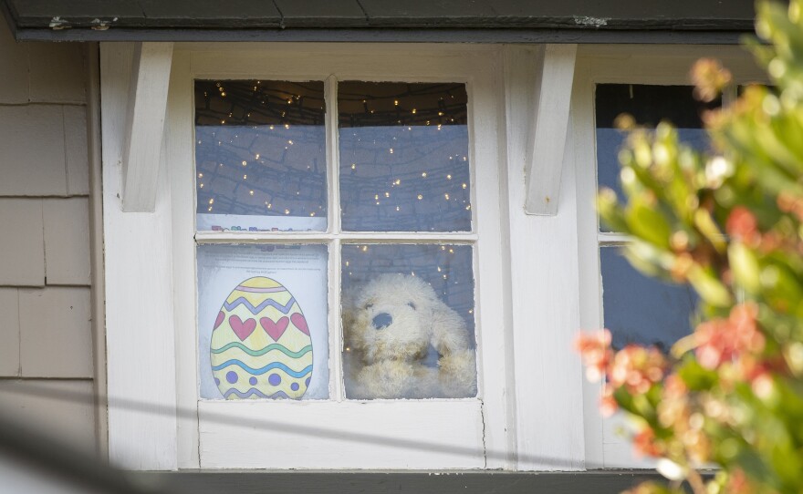 "You'll be pleased to know that we do consider both the tooth fairy and the Easter Bunny to be essential workers," New Zealand Prime Minister Jacinda Ardern says, approving the rabbit's operations during a lockdown. Here, an Easter egg drawing is seen in the window of a home in an Auckland suburb of Mount Eden on Tuesday.
